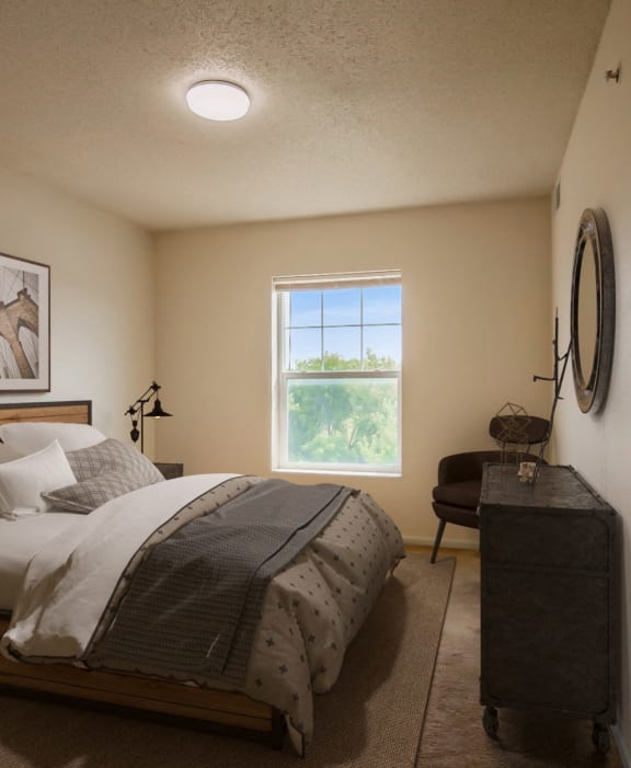a bedroom with a bed and a window
