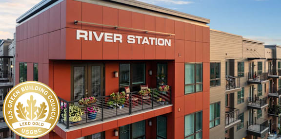 A building with the words "River Station" on it.
