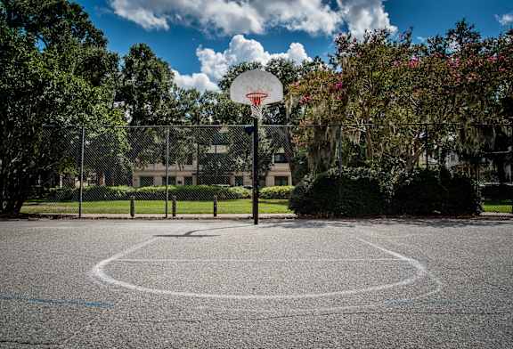 a basketball court in front of a building