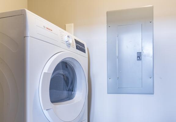 a washing machine and a dryer in a laundry room
