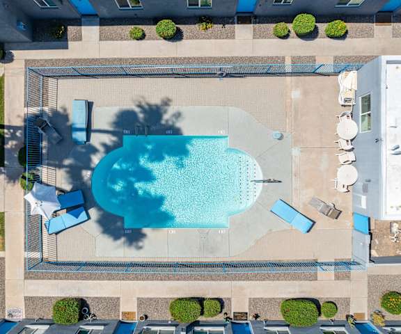 an overhead view of a swimming pool in the middle of a building