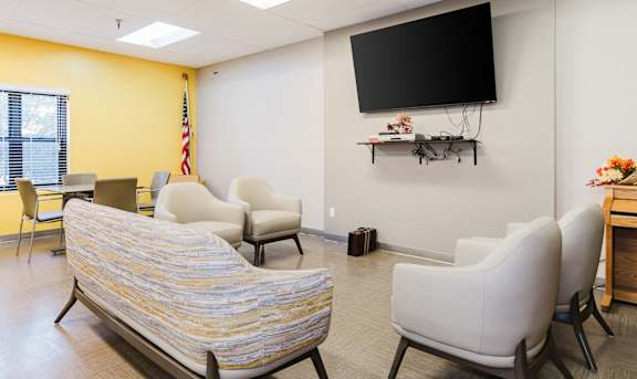 A room with a yellow wall and a black screen on the wall at Branchwood Towers, Clinton, MD, 20735