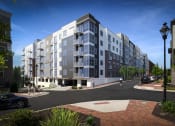 Thumbnail 10 of 35 - a rendering of a grey and white apartment building on a street corner at East 51 At Rocketts Landing, Richmond, 23231