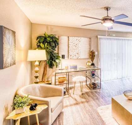 living room view with a couch and fan at Hillside Creek in Austin, TX
