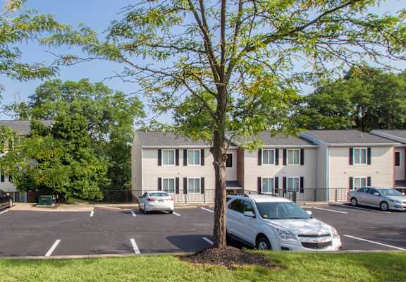 This is a picture of a couple of apartment buildings in a lush wooded setting at Deer Hill Apartments in Cincinnati Ohio.