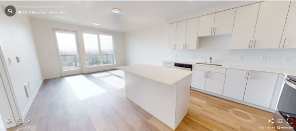 a kitchen with white cabinets and a white counter top