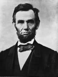 a man with a beard in a suit and tie