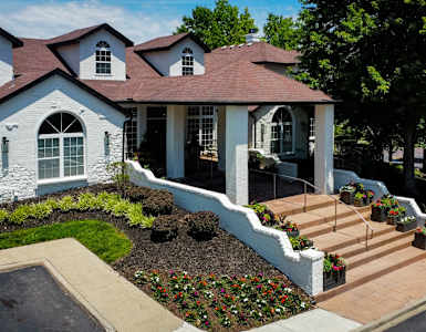 a house with a front porch and stairs in front of it