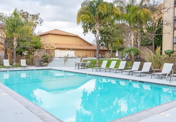 Pool with lounge chairs at BELLA VISTA AT HILLTOP, Richmond, 94806