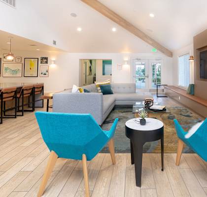 Clubhouse seating by fireplace at BELLA VISTA AT HILLTOP, Richmond, 94806