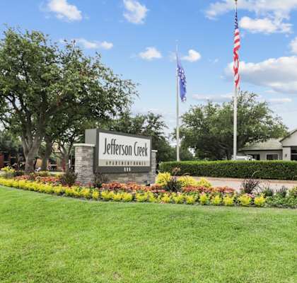 the view of the welcome sign at Jefferson Creek in Irving, TX