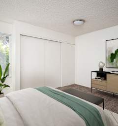 a bedroom with a bed and a large window