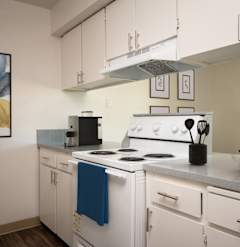 a kitchen with white appliances and white cabinets and a window