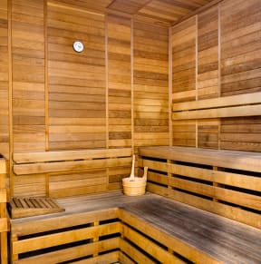 a large sauna with wooden walls and a table