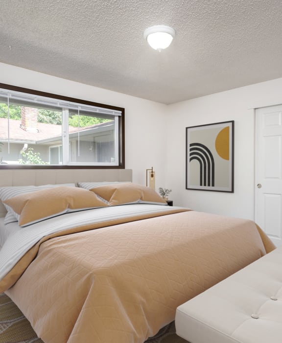 a bedroom with a bed and a window