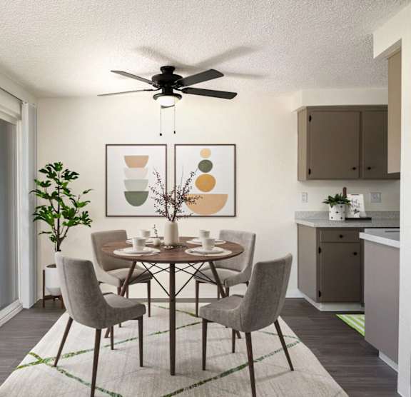 A dining room with a table set for four.