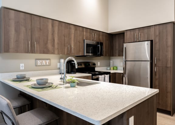 modern kitchen and living room in a 555 waverly unit