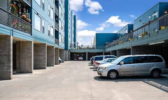 a row of parked cars in front of a building