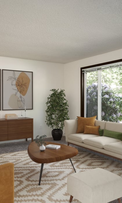 a living room with a white couch and a large window