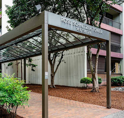 an exterior view of the rosemary tower condominiums in front of a building