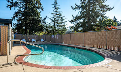 a resort style pool with a fence around it