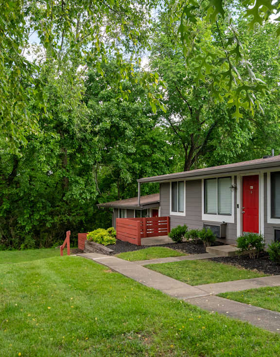 The Retreat at Indian Lake exterior with gray buildings and red doors
