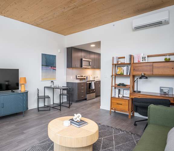 a living room with a couch and a table and a television