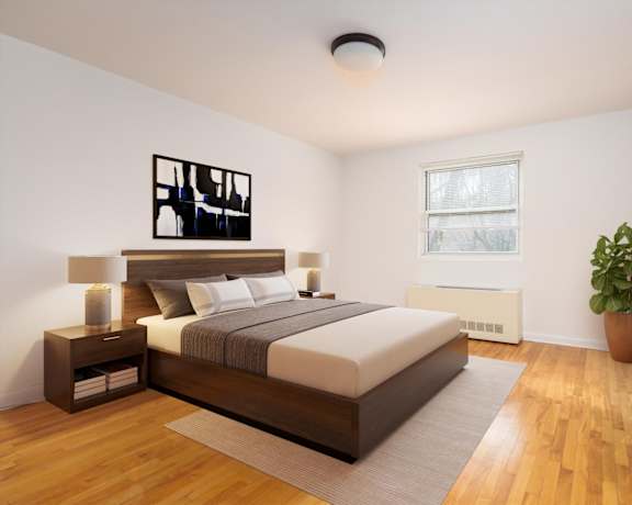 A bedroom with a bed, nightstand, and a plant.