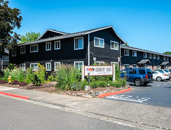 A black building with a sign that says "Country Bar".