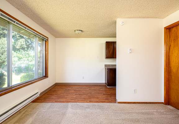 A room with a window and a door.