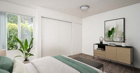 a bedroom with a bed and a large window