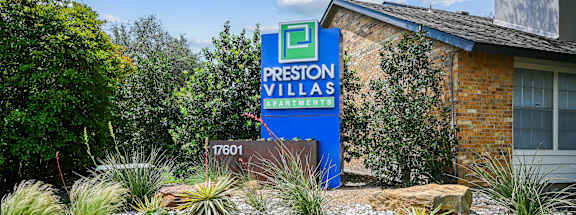 a picture of the front of the building with a sign in front of it