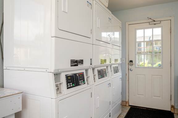 A white oven and microwave in a kitchen.