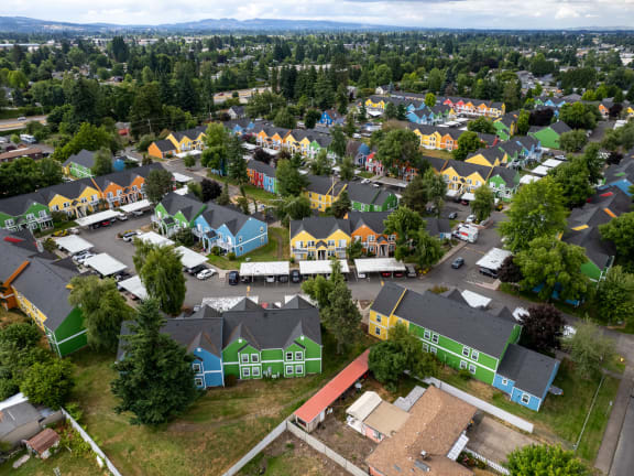 a birdseye view of a neighborhood with colorful houses