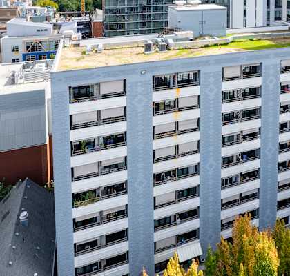 an aerial view of a building with a green roof