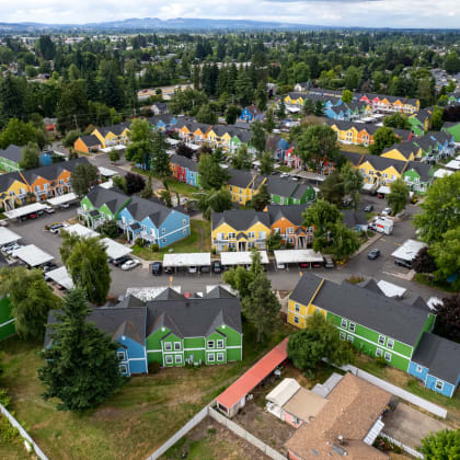 a birdseye view of a neighborhood with colorful houses