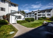 Thumbnail 11 of 32 - Farr Court Apartments Building Exterior and Pathway