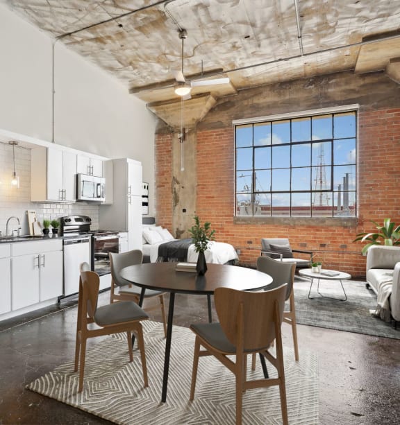a kitchen with a stove top oven and a microwave