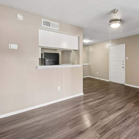 a kitchen and dining room with a table and chairs
