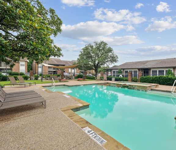 A pool with a sign that says "SAFETY FIRST" on the side.