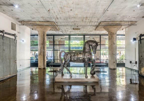 a statue of a horse in the middle of a room