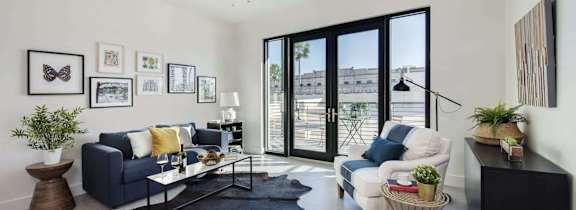 a rendering of a living room with a couch and a coffee table at Casa Marti, Tampa