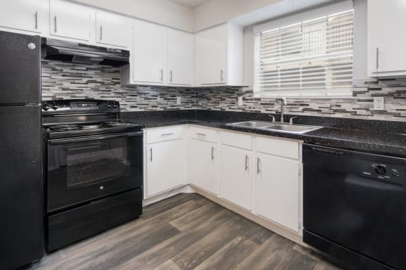 Kitchen with Black Appliances at Preston Villas Apartment Homes, Dallas, Texas, TX
