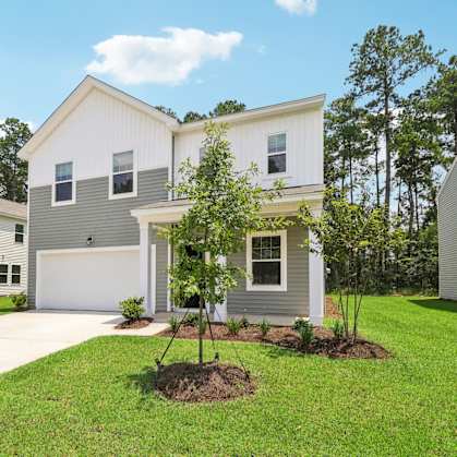 Sycamore side exterior view of a house with lawn at Beacon at Ashley River Landing in Summerville, SC