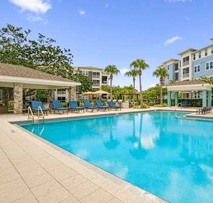 Beautiful resort-style pool at Dunedin Commons apartments in Dunedin, FL