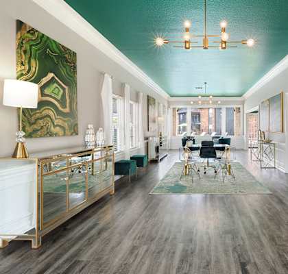 a living room with a teal ceiling and white walls