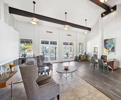 a large room with chairs and a table in it