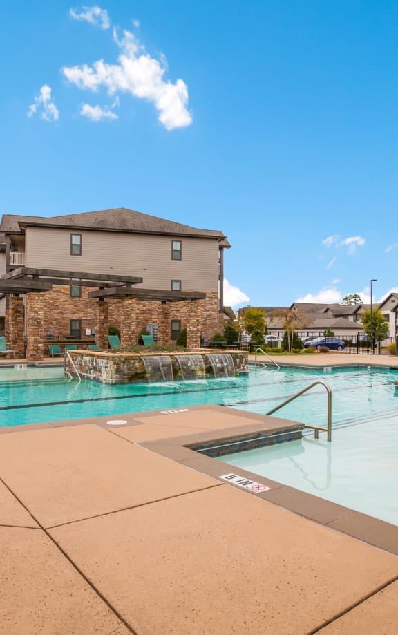 Swimming Pool with Fountain Feature at Patriot Park Apartment Homes in Fayetteville, NC,28311