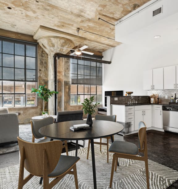 a kitchen with a stove top oven and a microwave