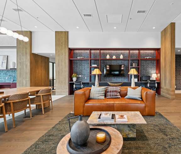 A reception area with a wooden bench and a display of shoes.
